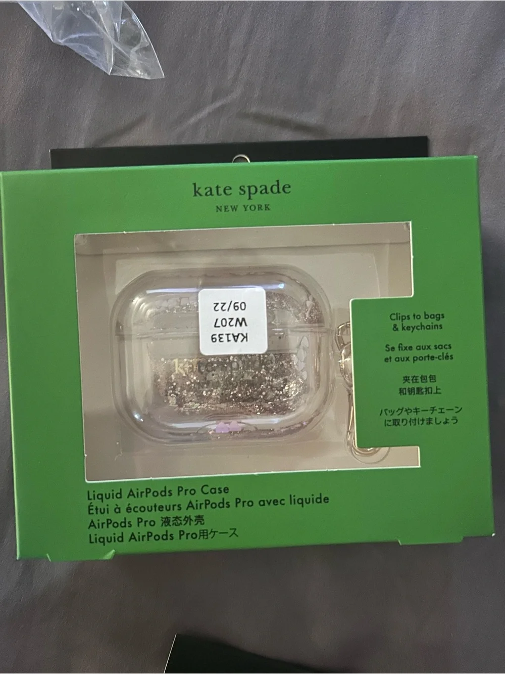 kate spade clear AirPods Pro case with gold glitter and pink accents